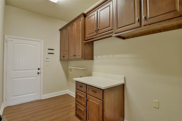 1306 Prestwick Ct, Granbury, TX 76048 - washroom featuring cabinet space and light wood-style flooring