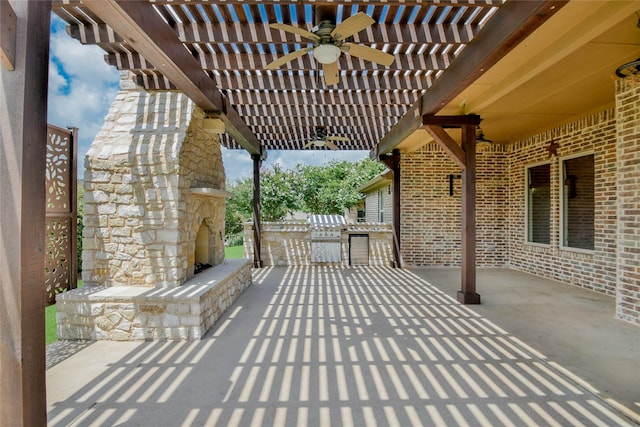 1306 Prestwick Ct, Granbury, TX 76048 - view of patio / terrace featuring an outdoor stone fireplace, ceiling fan, a pergola, and exterior kitchen