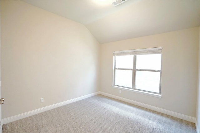 428 Gibbons Creek Trl, Mckinney, TX 75071 - spare room featuring light colored carpet and vaulted ceiling