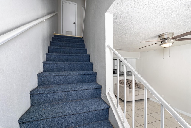 4927 Miller Ave, Fort Worth, TX 76119 - staircase with a ceiling fan and tile patterned flooring