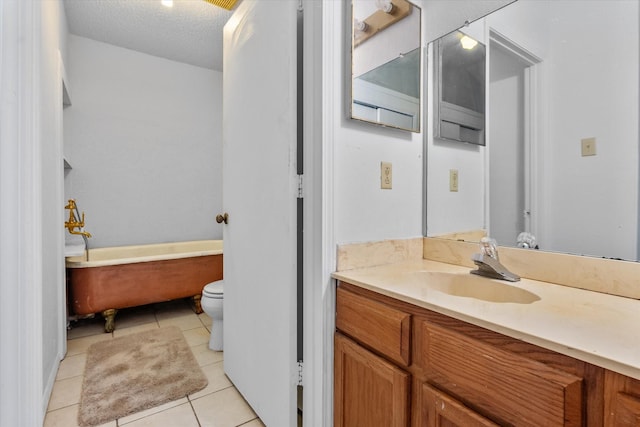5405 Four Winds Dr, Arlington, TX 76018 - full bath featuring a soaking tub, vanity, tile patterned floors, and a textured ceiling