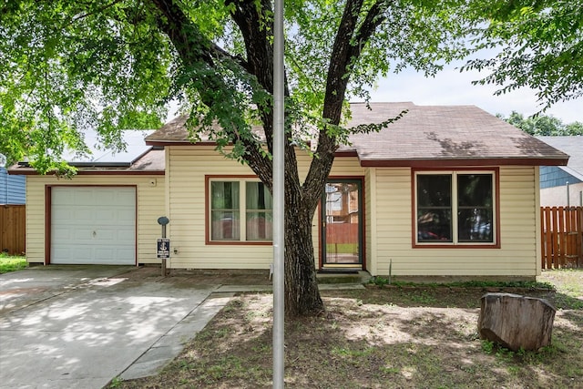 5405 Four Winds Dr, Arlington, TX 76018 - view of front of house with an attached garage, driveway, and roof with shingles