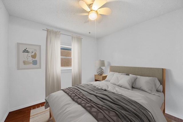 5405 Four Winds Dr, Arlington, TX 76018 - bedroom featuring wood finished floors and a ceiling fan