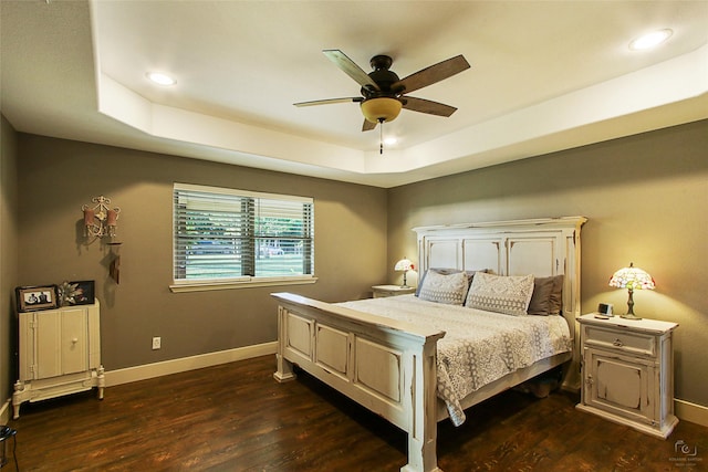 140 Stark Ln, Sherman, TX 75090 - bedroom with a tray ceiling, dark wood-type flooring, recessed lighting, and a ceiling fan