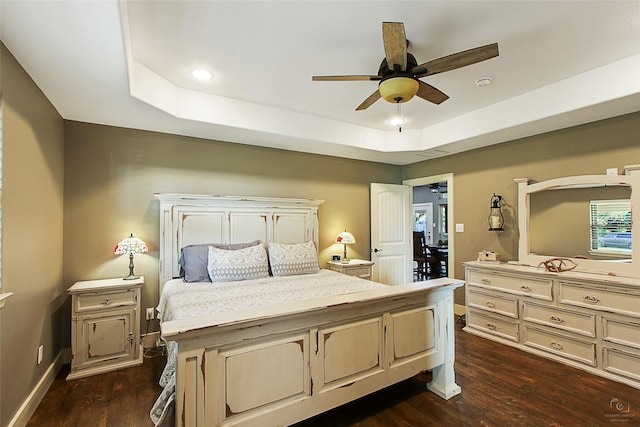140 Stark Ln, Sherman, TX 75090 - bedroom with a tray ceiling, dark wood-style floors, recessed lighting, and a ceiling fan