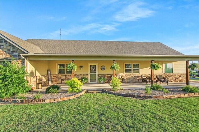 140 Stark Ln, Sherman, TX 75090 - back of property featuring stone siding and a yard