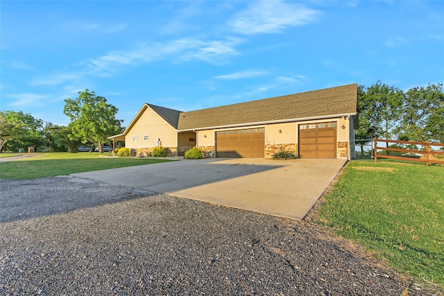 140 Stark Ln, Sherman, TX 75090 - view of front of home featuring concrete driveway, an attached garage, and stone siding