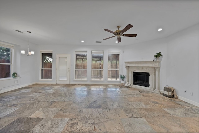 4418 Spring Garden Dr, Arlington, TX 76016 - unfurnished living room with stone tile flooring, a premium fireplace, ceiling fan, recessed lighting, and a chandelier