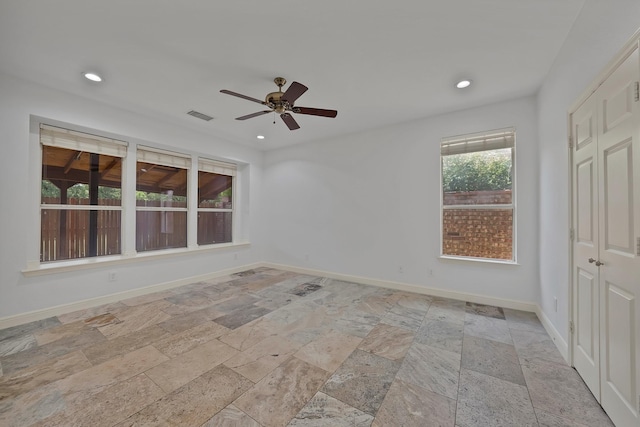 4418 Spring Garden Dr, Arlington, TX 76016 - unfurnished bedroom featuring stone tile floors, recessed lighting, a closet, and ceiling fan