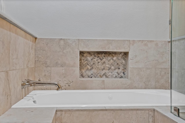 4418 Spring Garden Dr, Arlington, TX 76016 - bathroom with a bath and tile walls