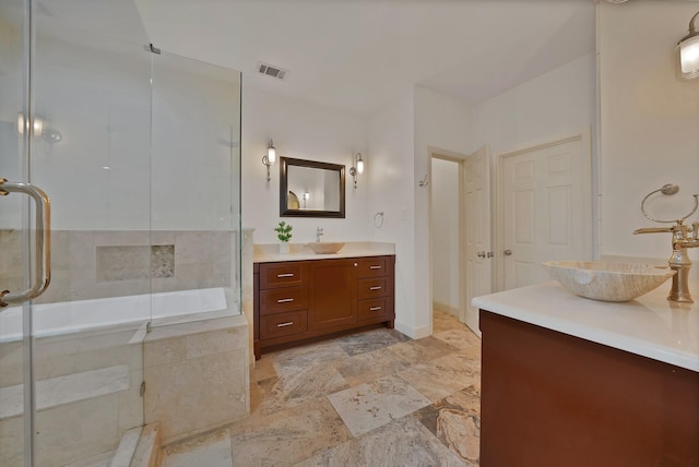4418 Spring Garden Dr, Arlington, TX 76016 - bathroom with vanity, a stall shower, and stone finish floors