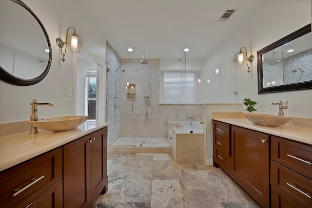 4418 Spring Garden Dr, Arlington, TX 76016 - bathroom featuring a stall shower, two vanities, a bath, healthy amount of natural light, and recessed lighting