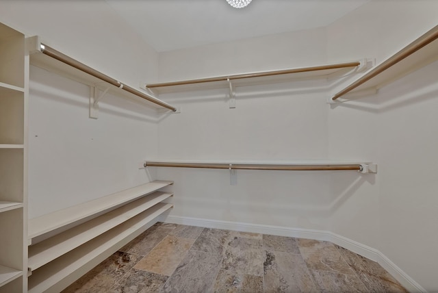 4418 Spring Garden Dr, Arlington, TX 76016 - spacious closet with stone finish flooring