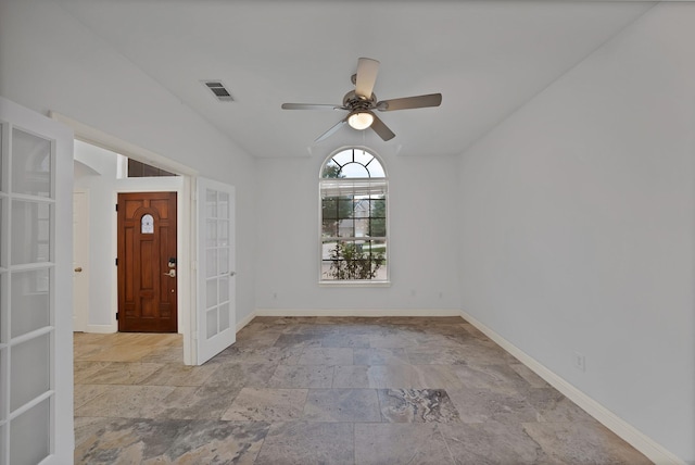 4418 Spring Garden Dr, Arlington, TX 76016 - unfurnished room featuring stone finish floors, vaulted ceiling, french doors, and ceiling fan