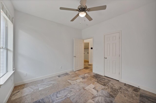 4418 Spring Garden Dr, Arlington, TX 76016 - unfurnished bedroom with stone finish floors and ceiling fan