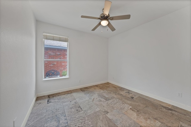 4418 Spring Garden Dr, Arlington, TX 76016 - spare room featuring stone tile floors and ceiling fan