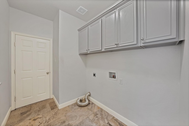 4418 Spring Garden Dr, Arlington, TX 76016 - laundry room featuring hookup for an electric dryer, cabinet space, hookup for a washing machine, and light stone finish floors