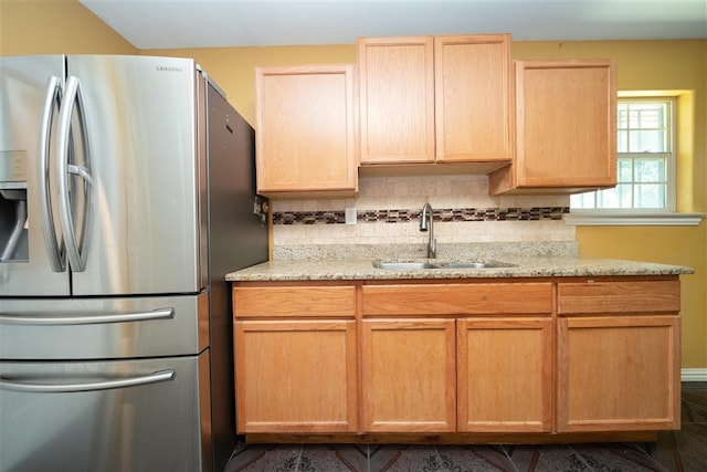1825 E Shore Dr, Dallas, TX 75217 - kitchen with freestanding refrigerator, backsplash, light brown cabinets, and light stone countertops