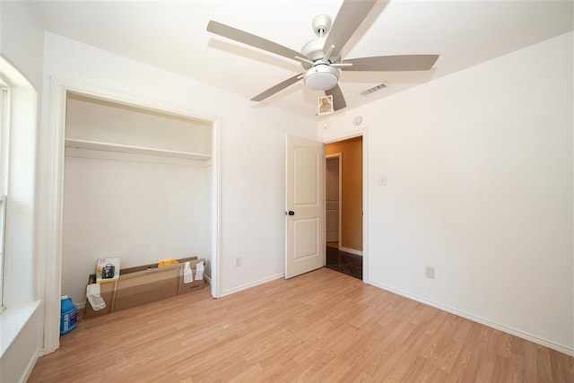 1825 E Shore Dr, Dallas, TX 75217 - unfurnished bedroom featuring light wood finished floors, a closet, and a ceiling fan