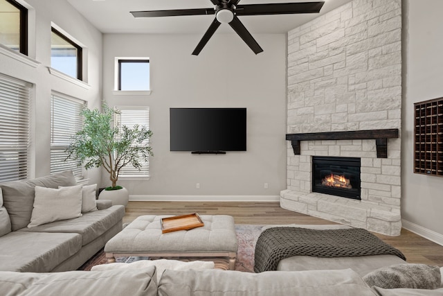 3000 Walker Way, Northlake, TX 76247 - living room with a fireplace, ceiling fan, wood finished floors, and a towering ceiling