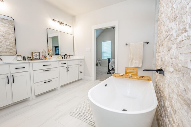 9209 Old Stoney Rd, Ponder, TX 76259 - full bathroom with double vanity, a freestanding bath, and connected bathroom