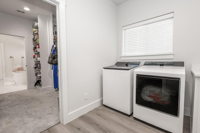 9209 Old Stoney Rd, Ponder, TX 76259 - laundry room featuring independent washer and dryer and light wood-style flooring