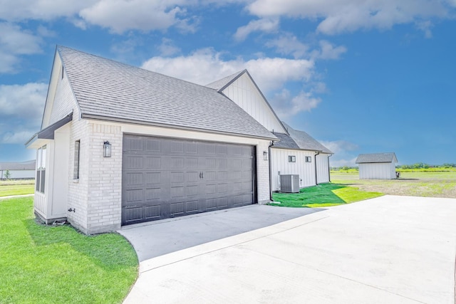 9209 Old Stoney Rd, Ponder, TX 76259 - view of side of property with board and batten siding, brick siding, a lawn, a shingled roof, and concrete driveway