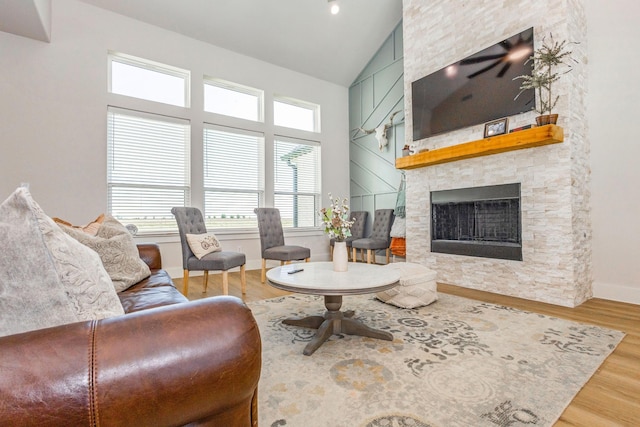9209 Old Stoney Rd, Ponder, TX 76259 - living room with wood finished floors, a fireplace, and high vaulted ceiling