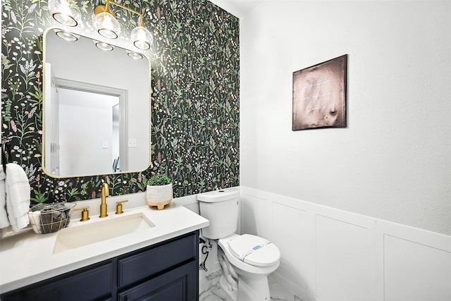 901 Bluebird Ct, Burleson, TX 76028 - half bath featuring wainscoting, wallpapered walls, vanity, marble look tile flooring, and a decorative wall