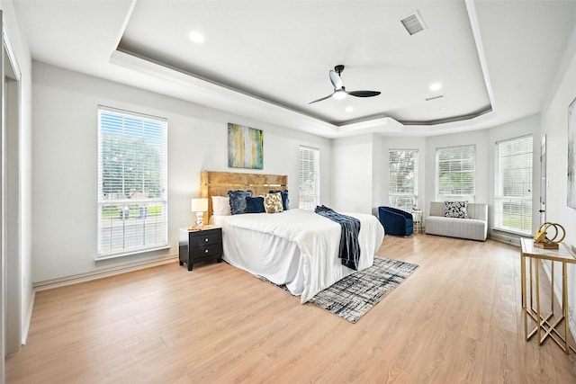 901 Bluebird Ct, Burleson, TX 76028 - bedroom with a tray ceiling, wood finished floors, recessed lighting, and ceiling fan