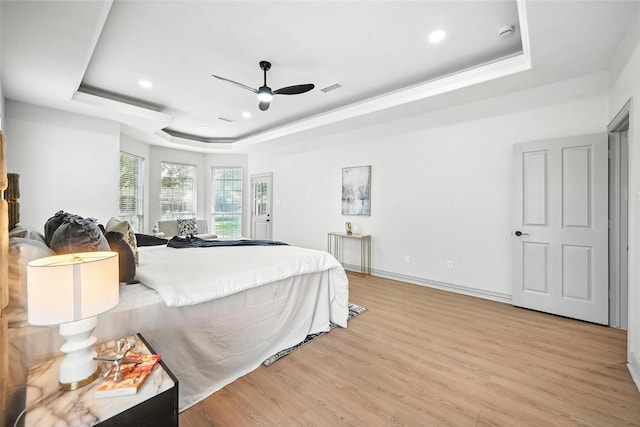901 Bluebird Ct, Burleson, TX 76028 - bedroom featuring a tray ceiling, light wood-style floors, recessed lighting, and a ceiling fan