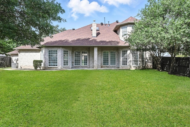 901 Bluebird Ct, Burleson, TX 76028 - back of property featuring a fenced backyard, a chimney, and a shingled roof