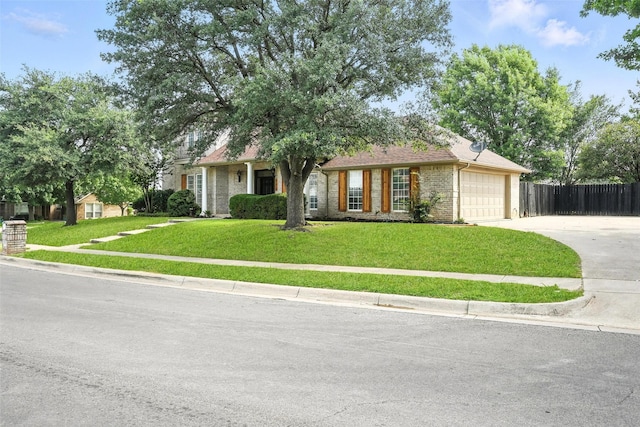 901 Bluebird Ct, Burleson, TX 76028 - view of front of home with concrete driveway, brick siding, and a garage