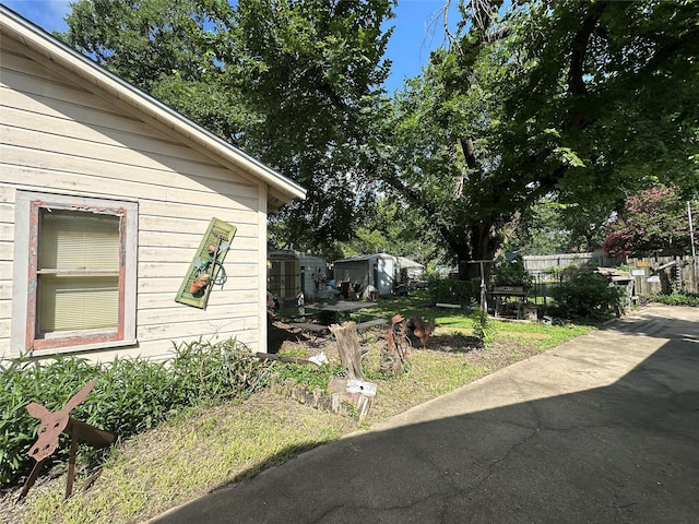 118 Woodland Ave, Corsicana, TX 75110 - view of side of home featuring a patio area and a storage shed