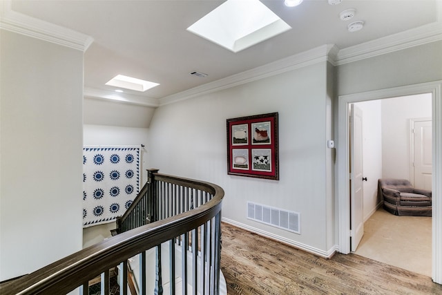 11937 Edgestone Rd, Dallas, TX 75230 - hall with a skylight, an upstairs landing, crown molding, and wood finished floors