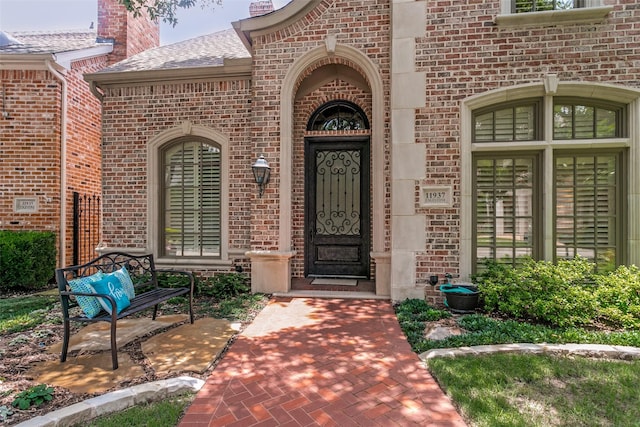 11937 Edgestone Rd, Dallas, TX 75230 - property entrance featuring brick siding and roof with shingles