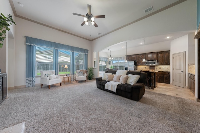 306 Spruce Trl, Forney, TX 75126 - living area featuring ceiling fan, light carpet, ornamental molding, and arched walkways