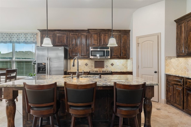 306 Spruce Trl, Forney, TX 75126 - kitchen with stainless steel appliances, decorative backsplash, and dark brown cabinets