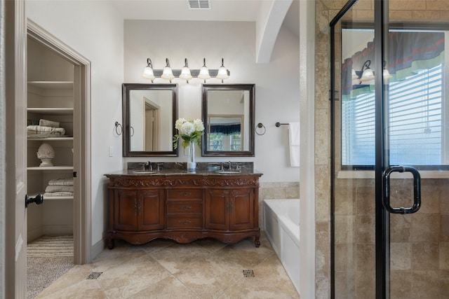 306 Spruce Trl, Forney, TX 75126 - full bath featuring double vanity, a garden tub, a shower stall, and tile patterned flooring