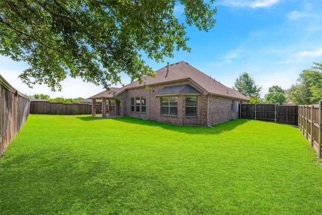 306 Spruce Trl, Forney, TX 75126 - rear view of house featuring a fenced backyard and brick siding