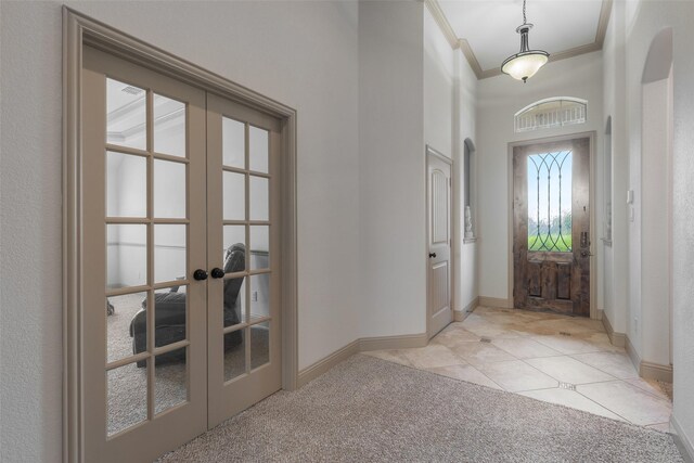 306 Spruce Trl, Forney, TX 75126 - entrance foyer featuring crown molding, french doors, light carpet, light tile patterned floors, and a towering ceiling