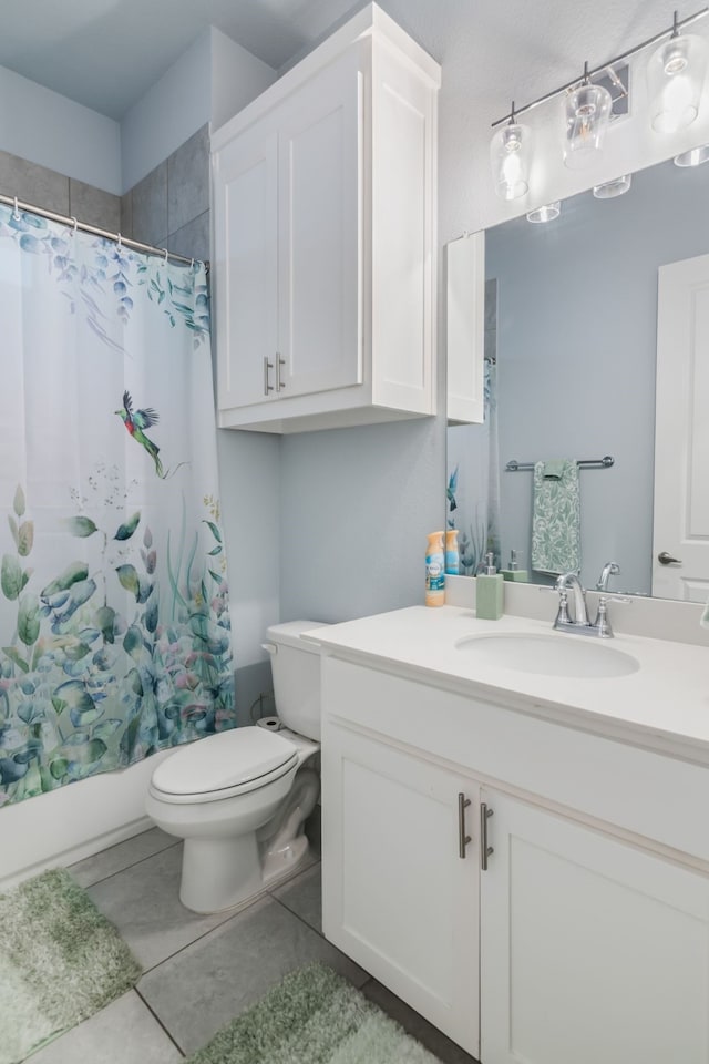 5616 Traveller Dr, North Richland Hills, TX 76180 - full bath featuring vanity, shower / bath combo with shower curtain, and tile patterned flooring