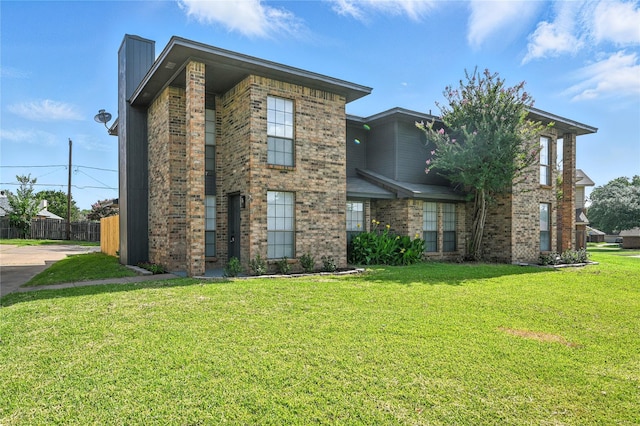 5717 Red Cactus Ct, Arlington, TX 76017 - view of front facade featuring brick siding and a chimney