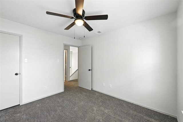 5717 Red Cactus Ct, Arlington, TX 76017 - unfurnished bedroom featuring carpet and ceiling fan