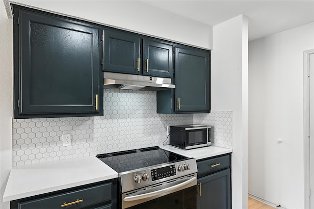 5717 Red Cactus Ct, Arlington, TX 76017 - kitchen featuring stainless steel electric range oven, under cabinet range hood, light countertops, and backsplash