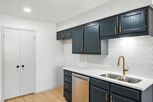 5717 Red Cactus Ct, Arlington, TX 76017 - kitchen with stainless steel dishwasher, light countertops, tasteful backsplash, light wood-style flooring, and recessed lighting