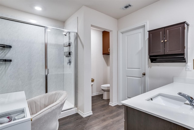 819 Twin Edge Dr, Royse City, TX 75189 - full bathroom with wood finished floors, a shower stall, vanity, and a freestanding bath