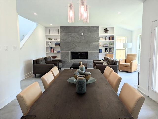 3763 Wenatche Dr, Dallas, TX 75233 - dining room featuring built in features, plenty of natural light, recessed lighting, vaulted ceiling, and a fireplace