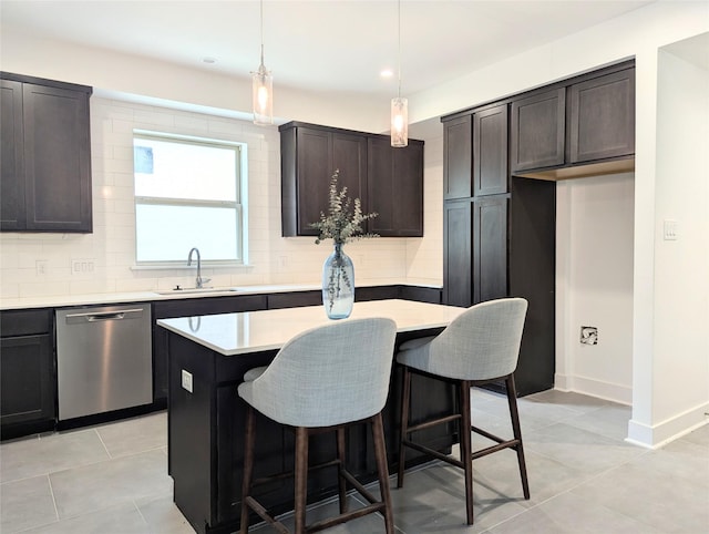 3763 Wenatche Dr, Dallas, TX 75233 - kitchen with dishwasher, backsplash, light tile patterned flooring, light countertops, and a kitchen island