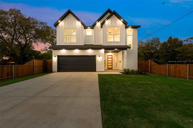 1403 Pueblo St, Dallas, TX 75212 - view of front of property with a garage, concrete driveway, and board and batten siding